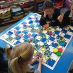 Playing snakes and ladders at Burgess Hill Girls