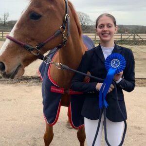 Student Violetta standing with Horse at Equestrian Competition